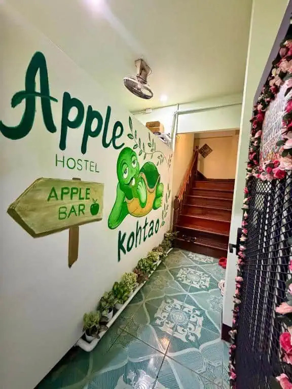 Painted Apple House Hostel and Apple Bar entrance sign